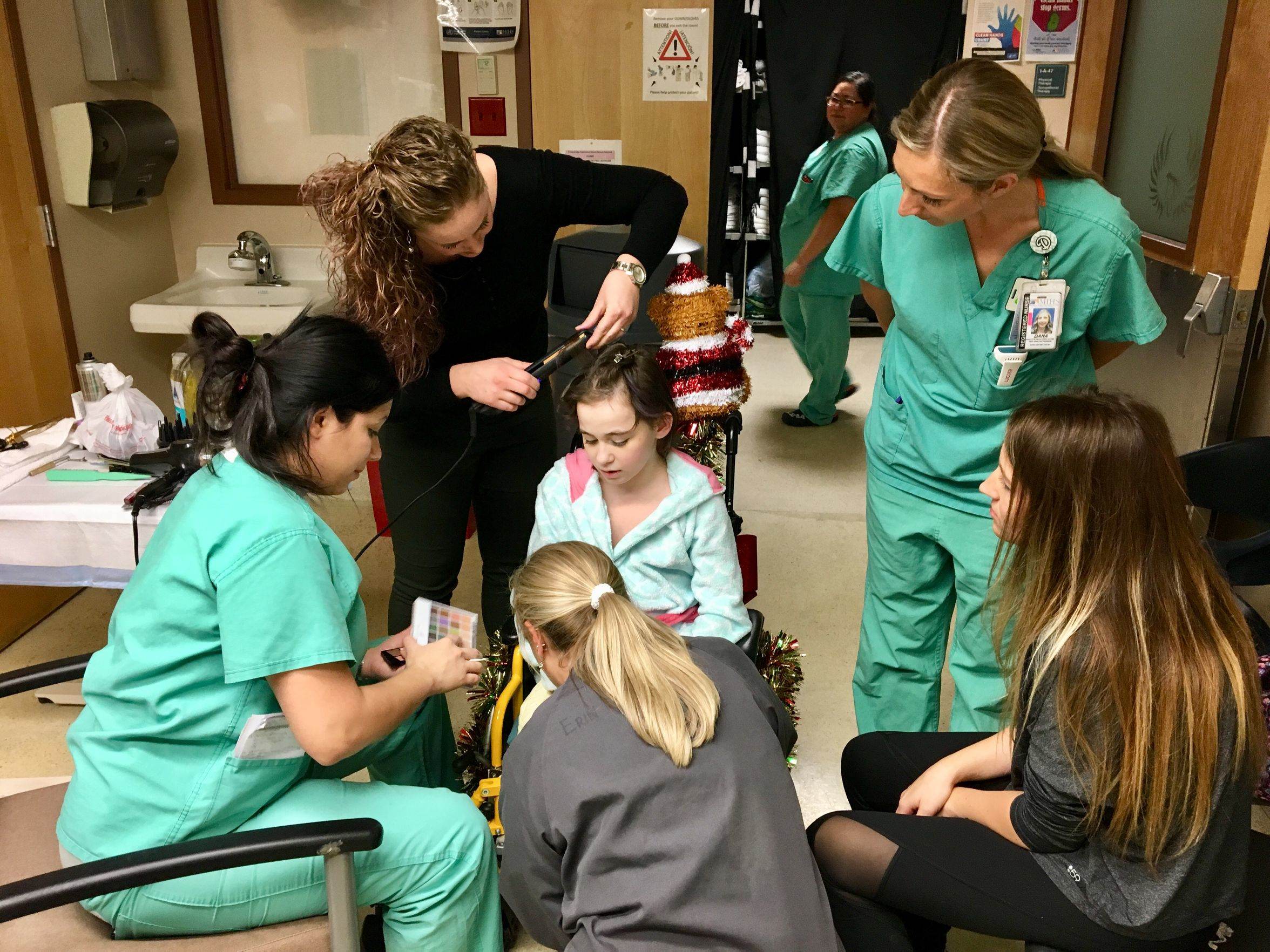 The staff at the Arizona Burn Center in Phoenix take time to help Isabella McCune get ready for her first night out of the hospital.