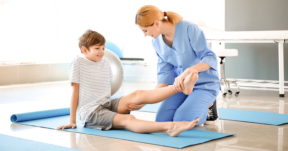 young child receiving physical therapy